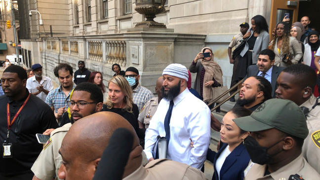 Adnan Syed, center, leaves the Elijah E. Cummings Courthouse, Monday, Sept. 19, 2022, in Baltimore. (AP Photo/Brian Witte)