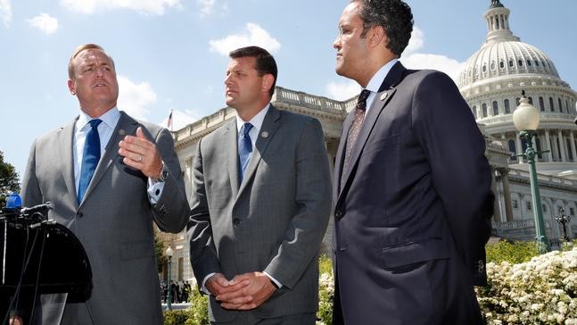Rep. Jeff Denham, R-Calif., left, speaks next to Rep. David Valadao, R-Calif., and Rep. Will Hurd, R-Texas, during a news conference with House Republicans who are collecting signatures on a petition to force House votes on immigration legislation, Wednesday, May 9, 2018, on Capitol Hill in Washington. (AP Photo/Jacquelyn Martin)