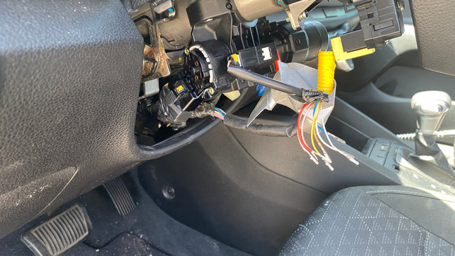 A steering wheel column disassembled after being hotwired and stolen (SBG San Antonio)